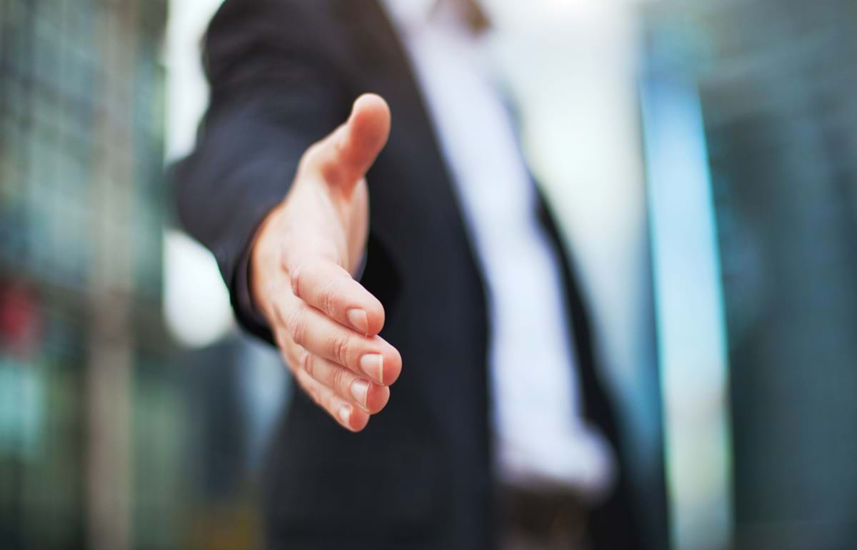 Hand Outstretched for Handshake, Business Partnership/Customer Service Concept